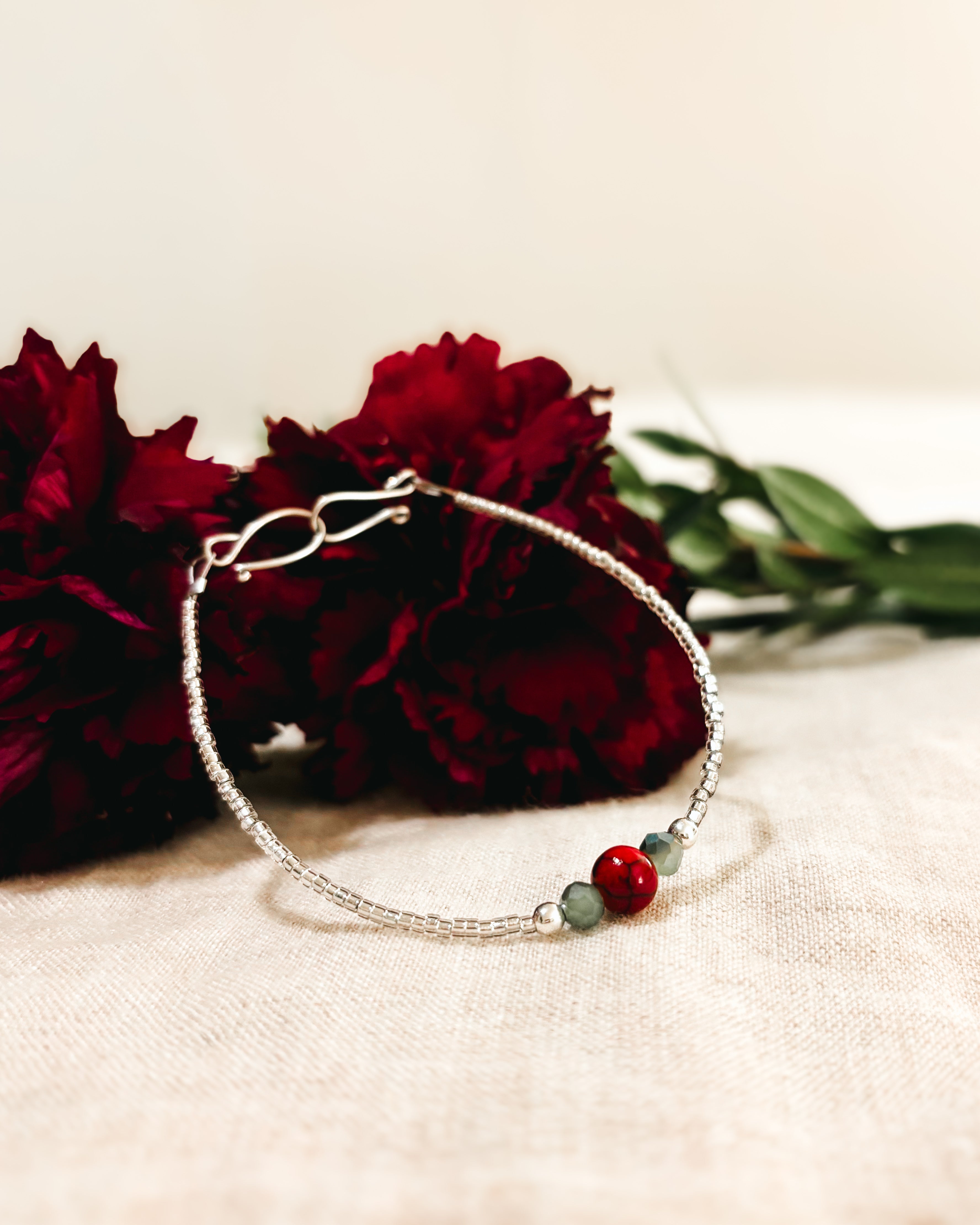 Delicate Beaded Bracelet with Red Quartz accent - Red, Green, and White