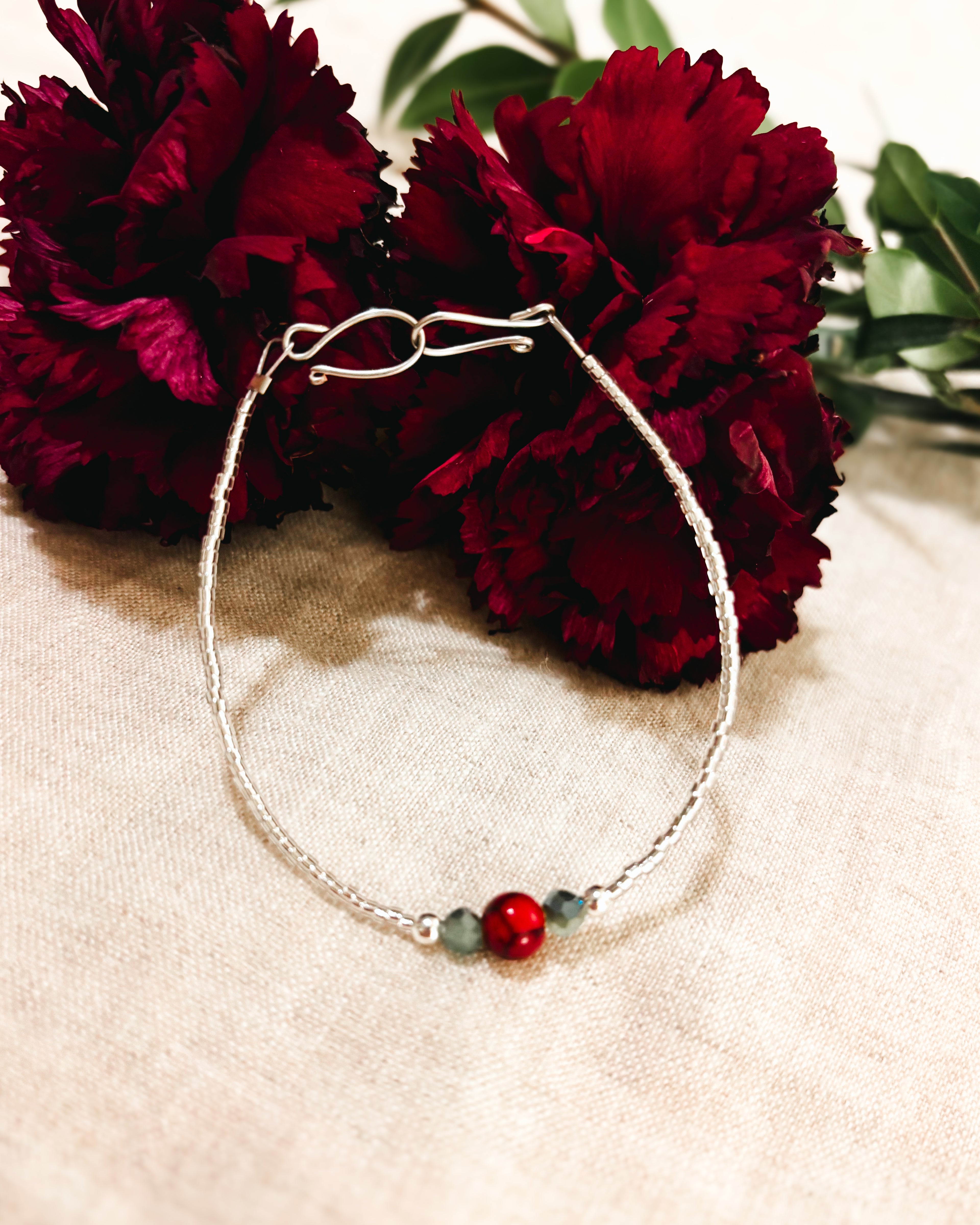 Delicate Beaded Bracelet with Red Quartz accent - Red, Green, and White