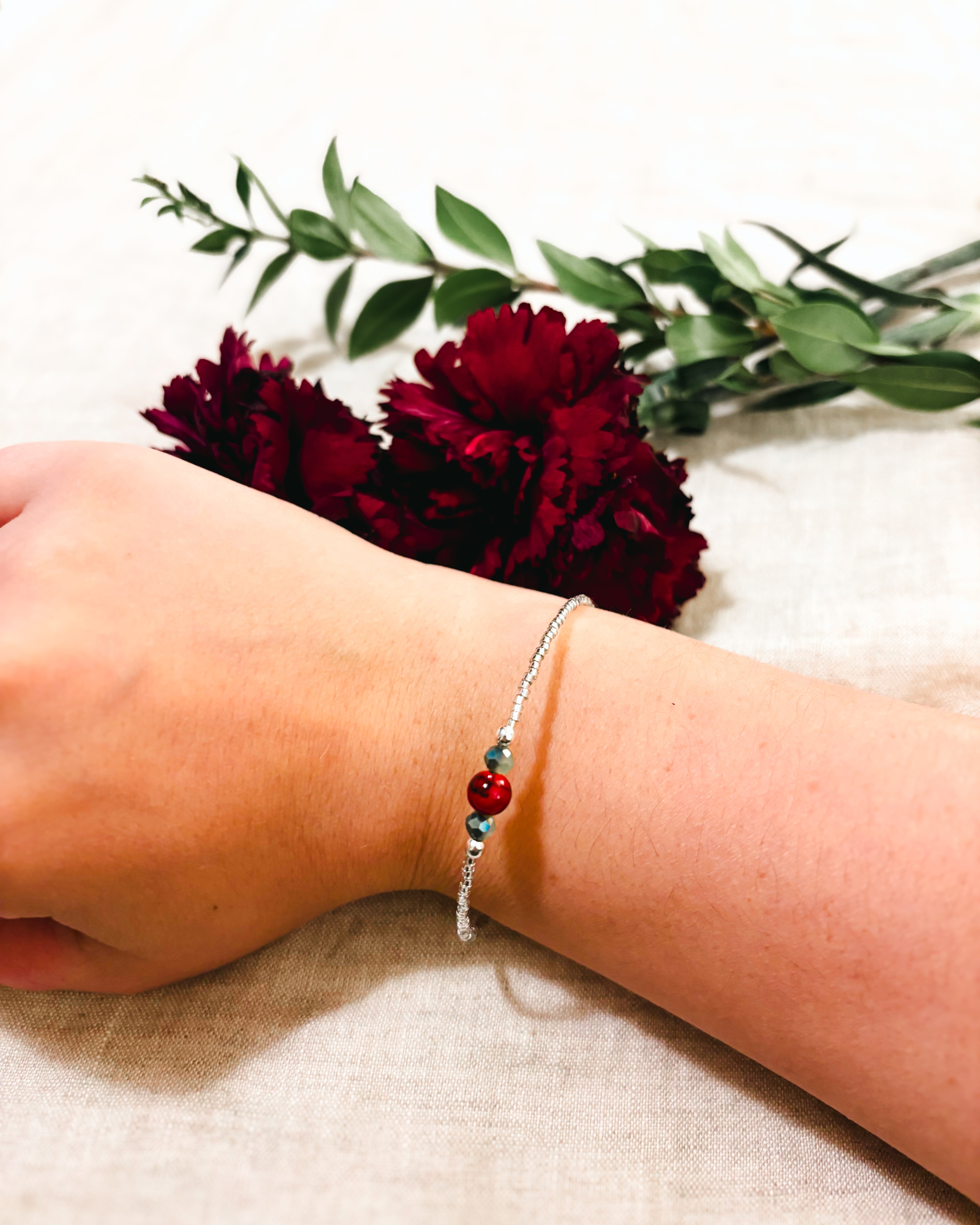 Delicate Beaded Bracelet with Red Quartz accent - Red, Green, and White
